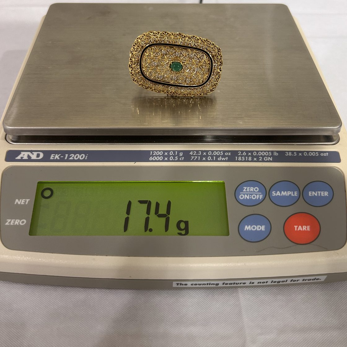 Filigree emerald brooch on the GoldVara scale