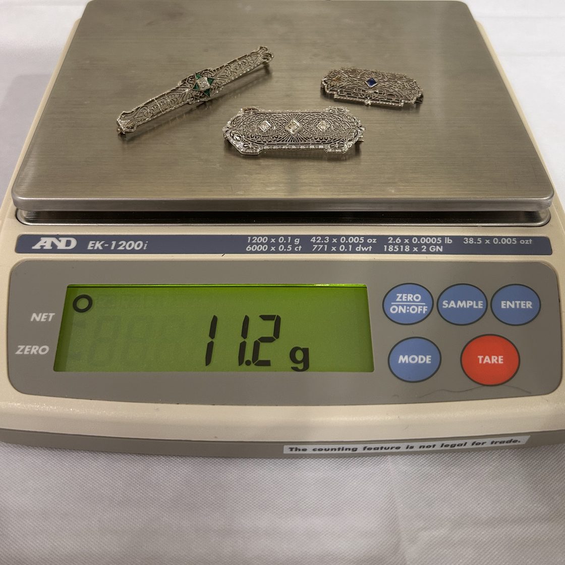 Three antique bar pins on the GoldVara scale