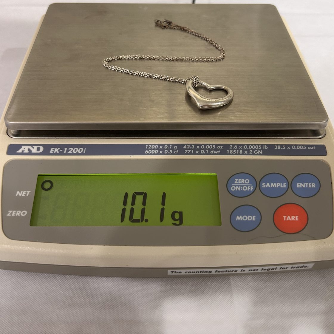 Designer open-heart necklace on the GoldVara scale