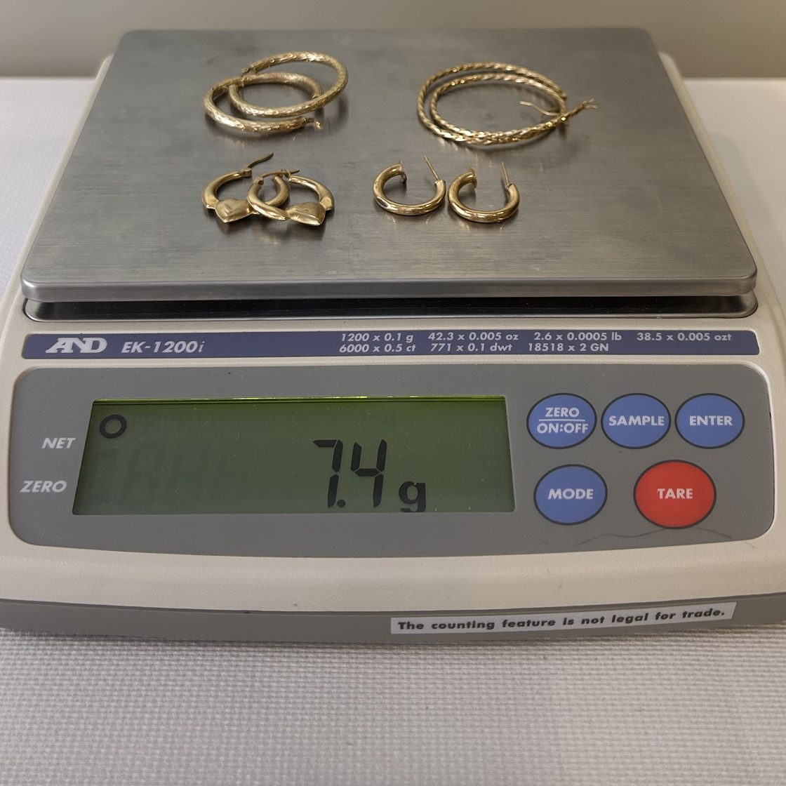 Four pairs of gold hoops on the GoldVara scale