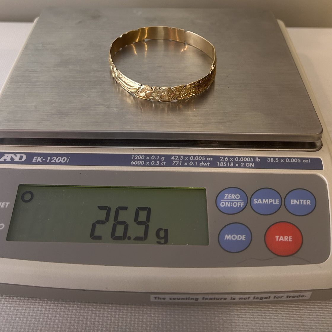 Engraved floral bangle on the GoldVara scale